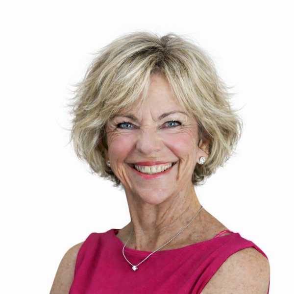 Amanda Gore smiling, in a magenta top