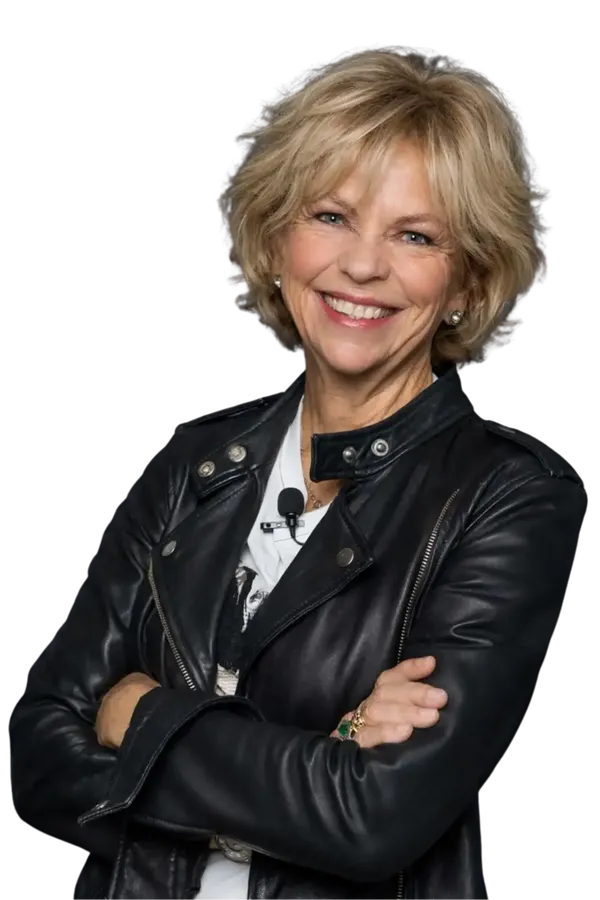 Amanda Gore, leadership speaker, smiling in a black leather jacket