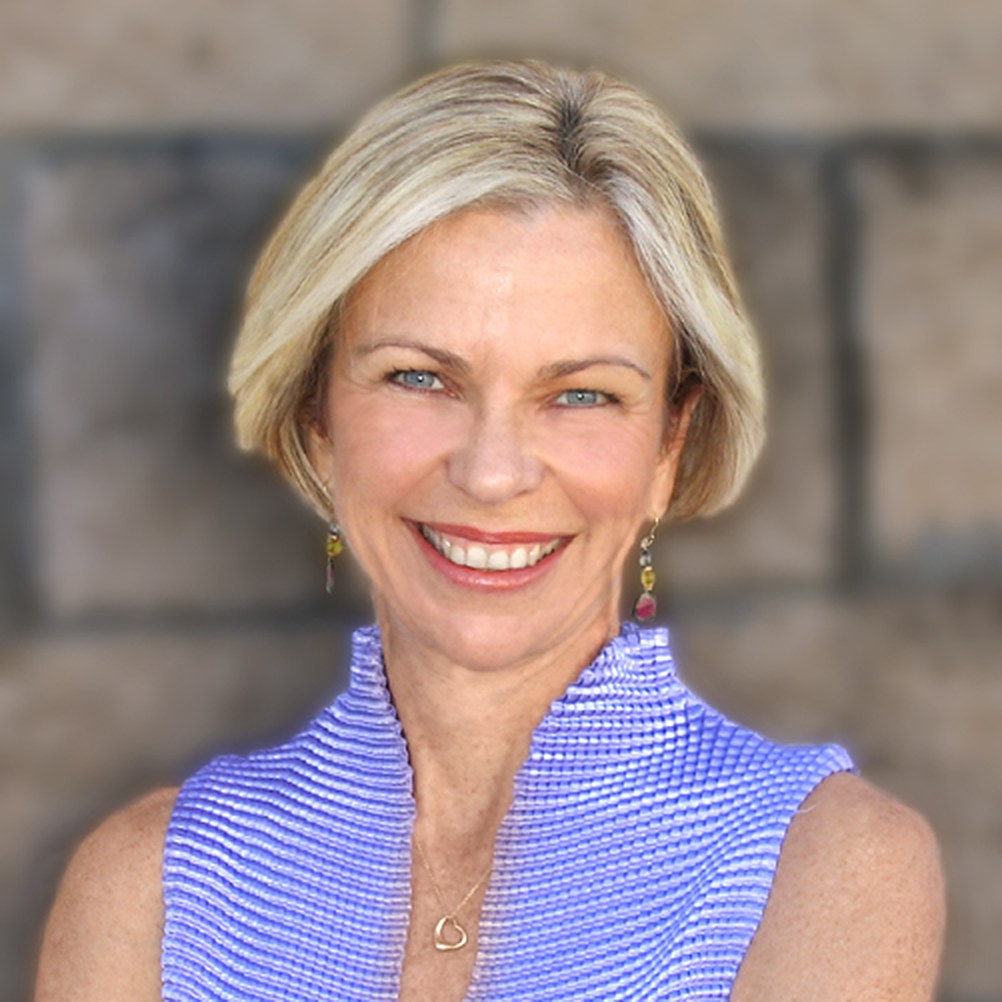 Amanda Gore, leadership speaker, smiling in a lavender top