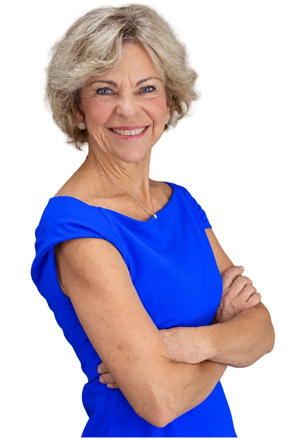 Amanda Gore, leadership speaker, smiling with her arms folded in a blue top