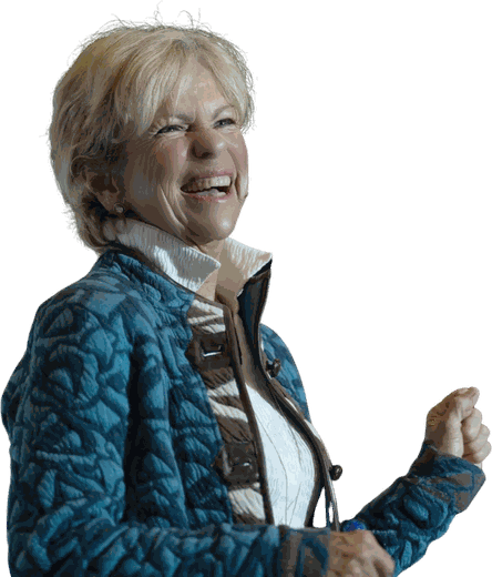 Amanda Gore, leadership speaker, laughing on stage