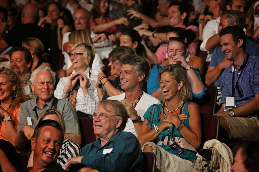 Conference audience laughing during an Amanda Gore keynote