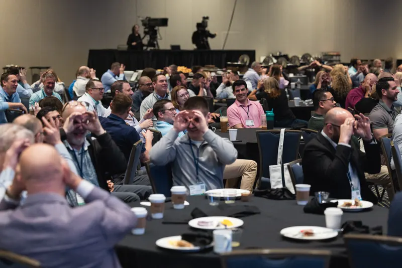 An audience laughing during an Amanda Gore keynote